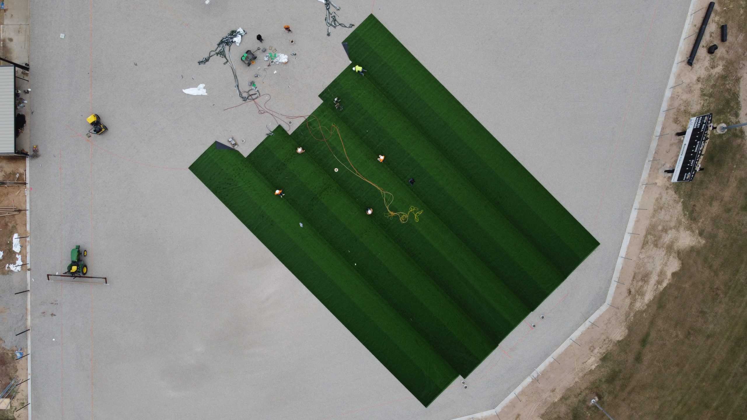An aerial view of an Astroturf sports field construction project by Symmetry.